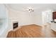 Living room with hardwood floors and a corner fireplace at 718 Surrey Park Se Pl, Smyrna, GA 30082