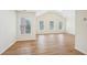Spacious living room featuring hardwood floors and abundant natural light at 718 Surrey Park Se Pl, Smyrna, GA 30082