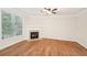 Living room with hardwood floors and a corner fireplace at 718 Surrey Park Se Pl, Smyrna, GA 30082
