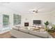 Virtually staged living room with fireplace and patio access at 718 Surrey Park Se Pl, Smyrna, GA 30082