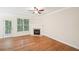 Living room with hardwood floors, fireplace, and door to patio at 718 Surrey Park Se Pl, Smyrna, GA 30082