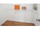 Large walk-in closet with wire shelving and hardwood floors at 718 Surrey Park Se Pl, Smyrna, GA 30082
