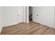 Clean bedroom features two doors, hardwood floors, and neutral wall color at 720 Perch Pl, Atlanta, GA 30312