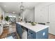 Bright open floor plan with a kitchen island, stainless appliances and hardwood flooring at 720 Perch Pl, Atlanta, GA 30312