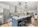 Well-lit, modern kitchen featuring stainless steel appliances and a center island with barstool seating at 720 Perch Pl, Atlanta, GA 30312