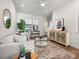 Stylishly decorated living room with hardwood floors, modern decor, and ample natural light at 720 Perch Pl, Atlanta, GA 30312