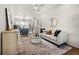 Bright open floor plan featuring kitchen and living room with stainless appliances and hardwood flooring at 720 Perch Pl, Atlanta, GA 30312