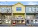 Colorful townhouses with individual entrances and balconies in a modern design community at 720 Perch Pl, Atlanta, GA 30312