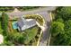 An aerial view showcasing the home's well-manicured lawn and charming curb appeal at 100 Chateau Pl, Woodstock, GA 30188