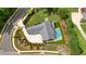 Overhead view of a backyard, featuring a pristine pool, well-maintained lawn, and patio area at 100 Chateau Pl, Woodstock, GA 30188