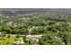 Overhead shot featuring landscaped grounds and large home with beautiful pool at 100 Chateau Pl, Woodstock, GA 30188