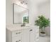 Bathroom vanity features a light countertop, dark fixtures, and white cabinetry at 100 Chateau Pl, Woodstock, GA 30188