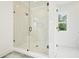Elegant glass shower with rainfall head and a built-in seat at 100 Chateau Pl, Woodstock, GA 30188