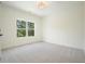 Light and airy bedroom with a window offering a serene view at 100 Chateau Pl, Woodstock, GA 30188