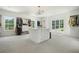 Large walk-in closet with island, custom shelving and bright windows at 100 Chateau Pl, Woodstock, GA 30188