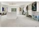 Spacious walk-in closet with custom shelving, central island, and ample storage at 100 Chateau Pl, Woodstock, GA 30188