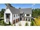 Beautiful two-story home with a three-car garage, covered porch, and modern design at 100 Chateau Pl, Woodstock, GA 30188