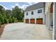 This home includes a spacious three-car garage and plenty of driveway parking at 100 Chateau Pl, Woodstock, GA 30188