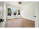 Bright living room with hardwood floors and large windows, filling the space with natural light at 100 Chateau Pl, Woodstock, GA 30188