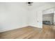 Bright, open room with hardwood floors leads to a comfortable living space with gray sofa at 100 Chateau Pl, Woodstock, GA 30188