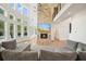 Bright, open living room features fireplace, a wall of windows and gray couches at 100 Chateau Pl, Woodstock, GA 30188