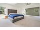 Inviting main bedroom featuring an accent wall, windows, and plush carpet flooring at 100 Chateau Pl, Woodstock, GA 30188