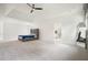 Spacious main bedroom with tray ceilings, a ceiling fan, and plush carpet flooring at 100 Chateau Pl, Woodstock, GA 30188