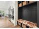 This mudroom features custom built-ins and stainless steel appliances in a well-lit space at 100 Chateau Pl, Woodstock, GA 30188