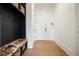 Organized mudroom with custom storage, bench seating, coat hooks, and easy access to the home's interior at 100 Chateau Pl, Woodstock, GA 30188
