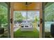 Cozy covered patio with plush seating, outdoor plants, and view of the pool at 100 Chateau Pl, Woodstock, GA 30188