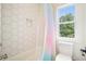 Charming bathroom with hexagon tile and a colorful shower curtain at 100 Chateau Pl, Woodstock, GA 30188
