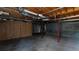 Unfinished basement with exposed support beams at 791 Cross Plains Hulett Rd, Carrollton, GA 30116