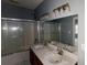 Bathroom with double vanity, large mirror and tub shower combo at 791 Cross Plains Hulett Rd, Carrollton, GA 30116
