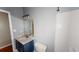 Bathroom with a blue vanity, toilet, and shower at 791 Cross Plains Hulett Rd, Carrollton, GA 30116