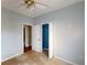 Small bedroom with carpet, ceiling fan, and closet at 791 Cross Plains Hulett Rd, Carrollton, GA 30116