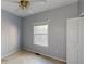 Simple bedroom with carpet flooring, a window, and closet at 791 Cross Plains Hulett Rd, Carrollton, GA 30116