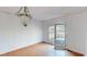 Bright dining room with hardwood floors and deck access at 791 Cross Plains Hulett Rd, Carrollton, GA 30116