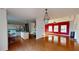 Open concept kitchen and dining area with hardwood floors and island at 791 Cross Plains Hulett Rd, Carrollton, GA 30116