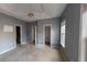 Main bedroom with carpeted floor, neutral walls and ceiling fan at 791 Cross Plains Hulett Rd, Carrollton, GA 30116