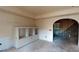 Unfinished basement with built-in shelving and arched entryway at 791 Cross Plains Hulett Rd, Carrollton, GA 30116
