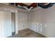 Unfinished basement room with a door and drywall at 791 Cross Plains Hulett Rd, Carrollton, GA 30116