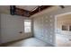 Unfinished basement room with a window and doorway at 791 Cross Plains Hulett Rd, Carrollton, GA 30116