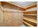 Spacious closet with wood shelving and hanging rod at 2044 Wilandrew Dr, Decatur, GA 30033