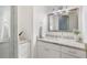 Bright bathroom featuring granite countertop, white cabinets and a shower with glass door at 4070 Whitewater Creek Nw Rd, Atlanta, GA 30327