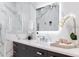 Modern bathroom featuring a sleek vanity, stylish mirror, and elegant marble walls, creating a luxurious and relaxing space at 4070 Whitewater Creek Nw Rd, Atlanta, GA 30327