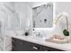 Bathroom vanity featuring marble backsplash, sleek faucet, and decorative accents for a luxurious feel at 4070 Whitewater Creek Nw Rd, Atlanta, GA 30327