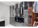 This luxury walk-in closet has plenty of storage and room for accessories at 4070 Whitewater Creek Nw Rd, Atlanta, GA 30327