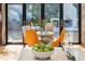 Bright dining area with backyard views features modern chairs and elegant decor at 4070 Whitewater Creek Nw Rd, Atlanta, GA 30327