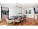 Dining room with wood floors, modern light fixture, and artwork on the walls at 4070 Whitewater Creek Nw Rd, Atlanta, GA 30327