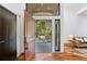 Open foyer showcasing a modern door, gleaming hardwood floors, and an inviting atmosphere at 4070 Whitewater Creek Nw Rd, Atlanta, GA 30327
